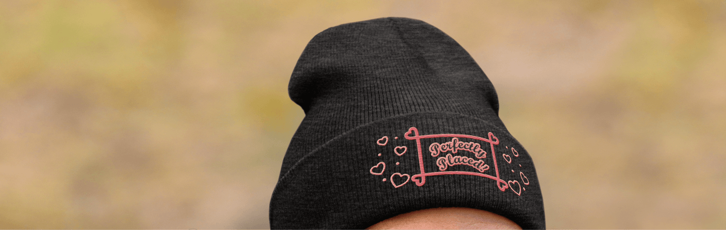 Cuffed brown or dark gray multi-color perfectly placed women’s beanie.