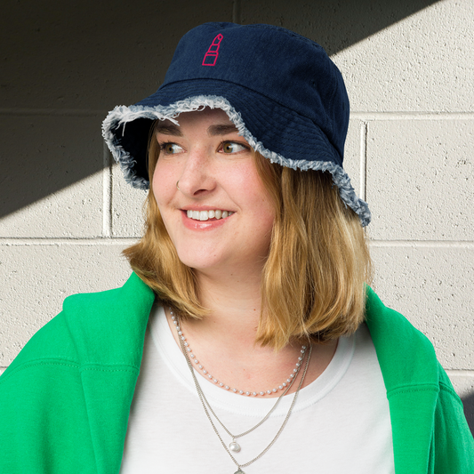 Hot pink women’s distressed denim bucket hat.