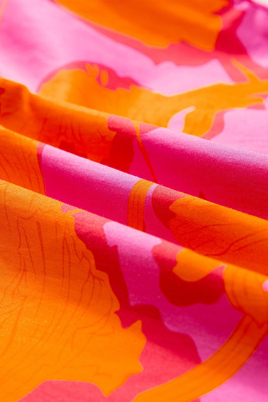 Ruffled fuchsia and multi-color cap sleeve women’s blouse.