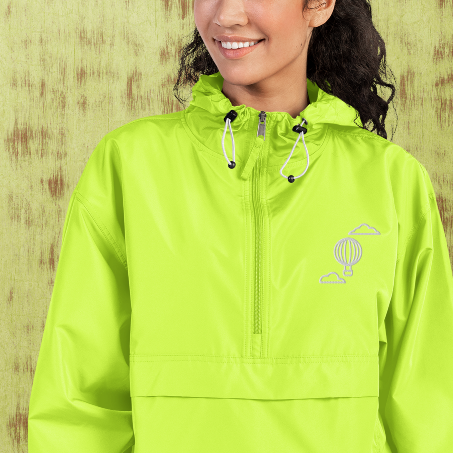 Highlighter green and gray champion® women’s packable jacket.