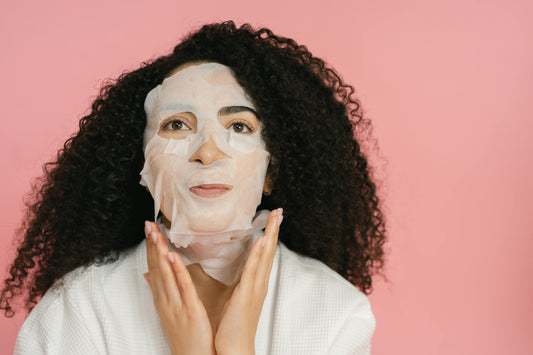 Young woman practicing self-care with a face mask.