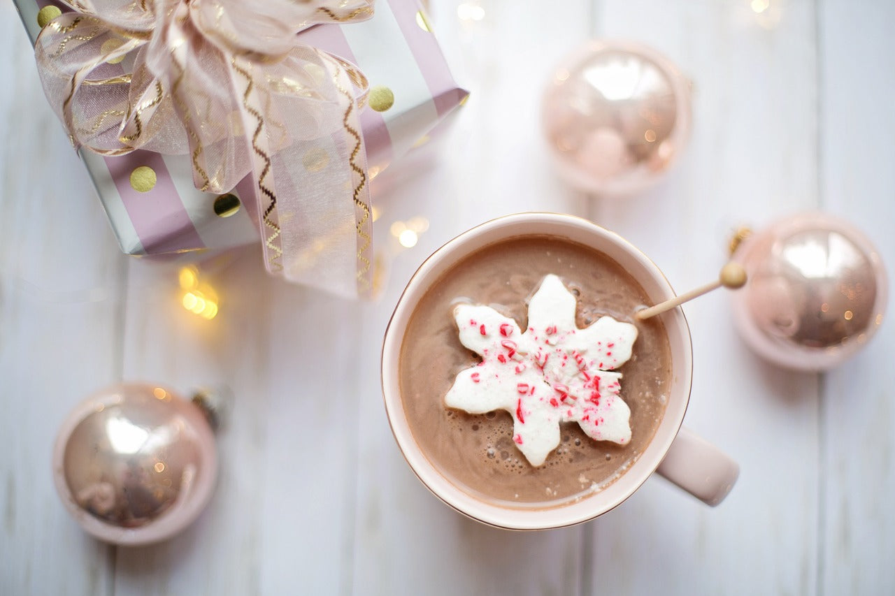 Christmas light bulbs and a winter mug in scene together.