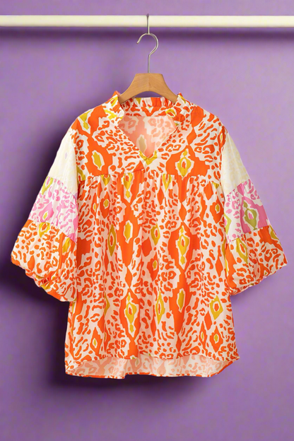 Orange half sleeve women’s blouse.