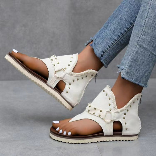 Denim studded raw hem women’s sandals.