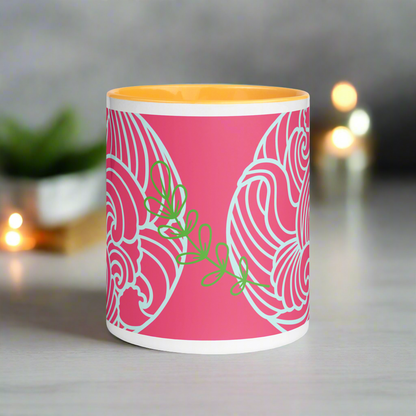 Hot pink and multi-color mug with color inside.