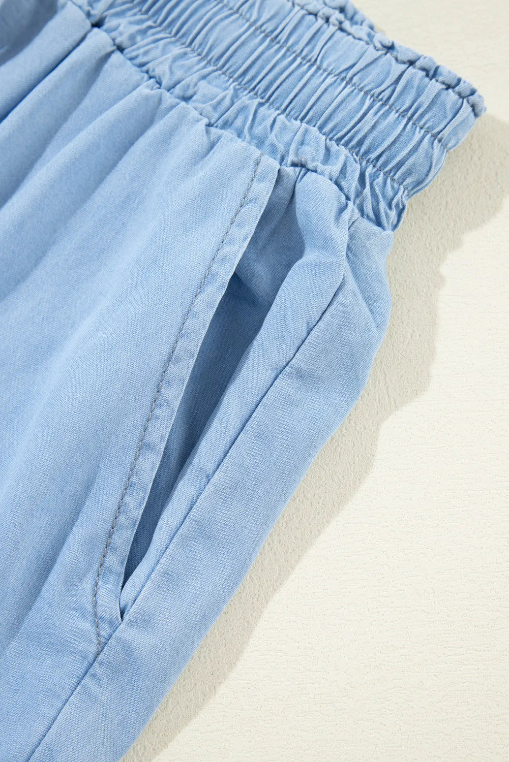 Drawstring denim pocketed women’s palazzo pants.