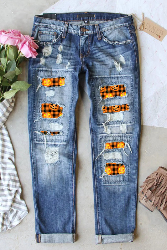 Distressed medium-wash pumpkin women’s denim jeans with pockets.