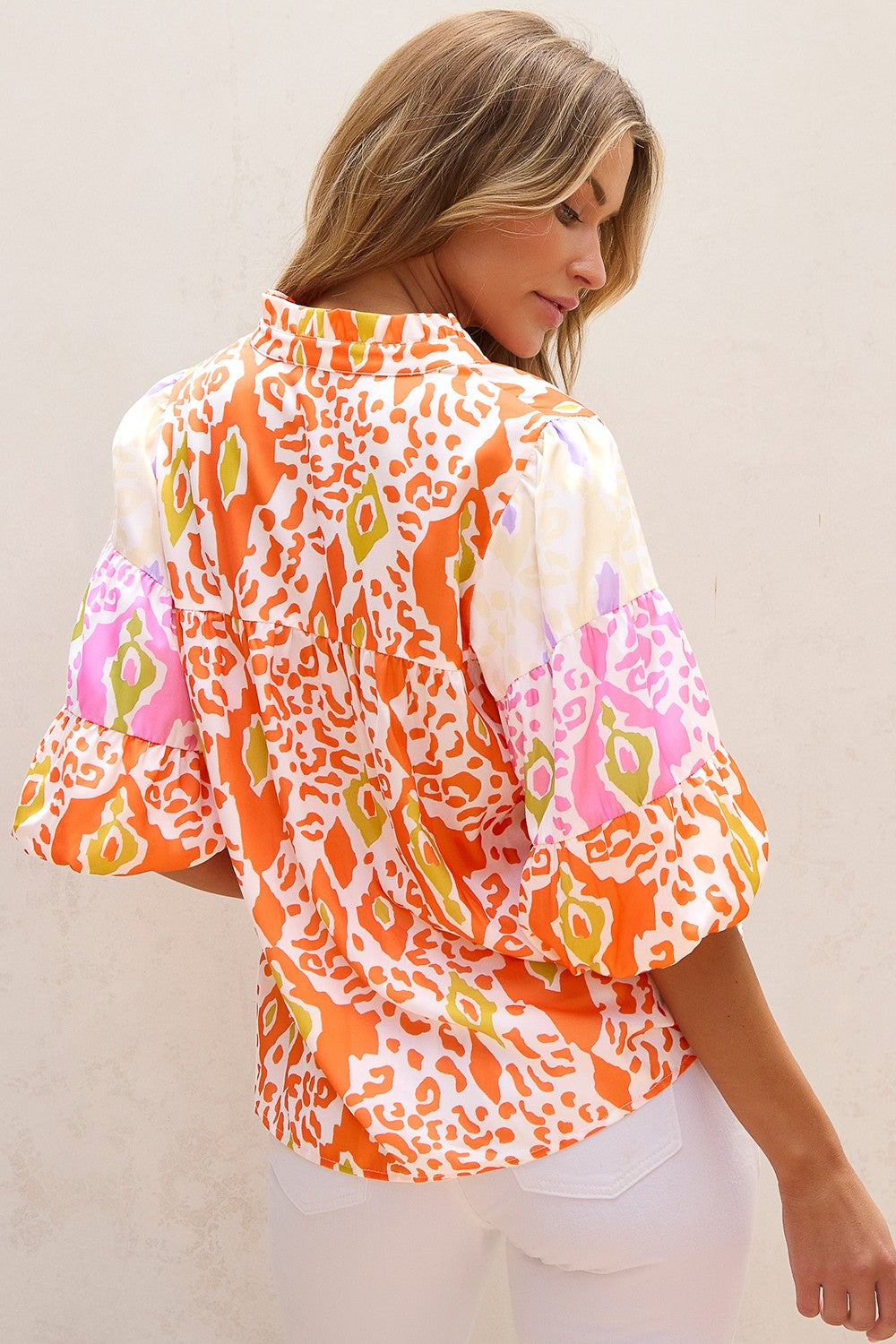 Orange half sleeve women’s blouse.