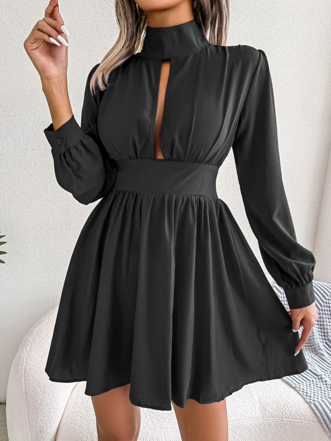 Turtleneck and cut-out women’s mini dress.