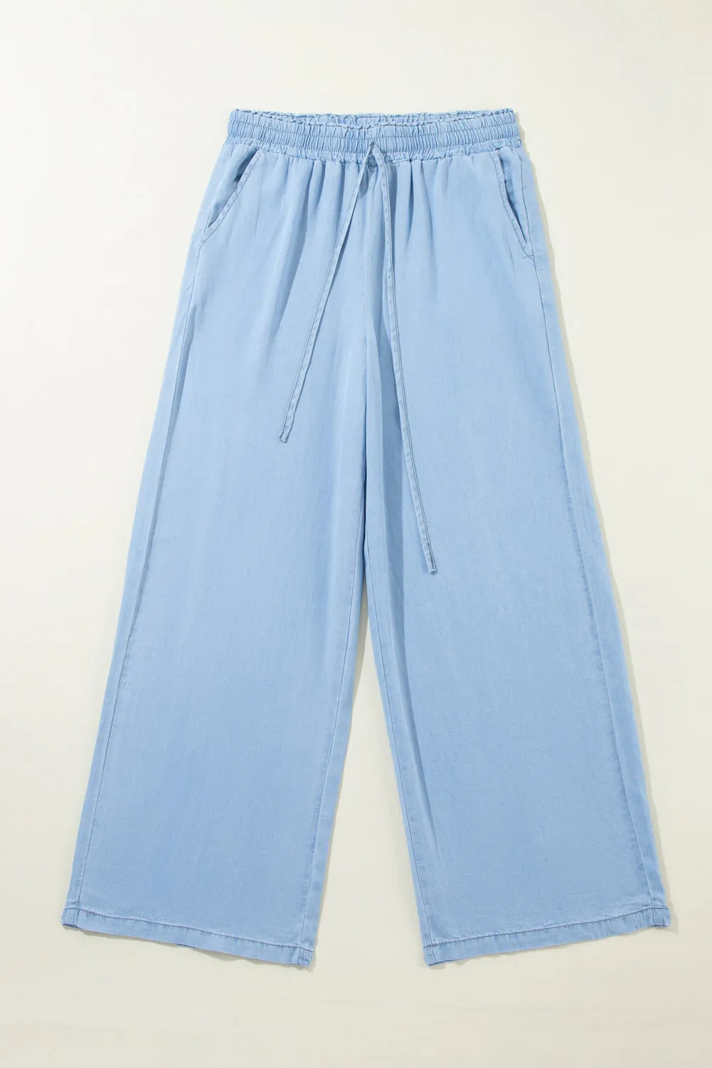 Drawstring denim pocketed women’s palazzo pants.