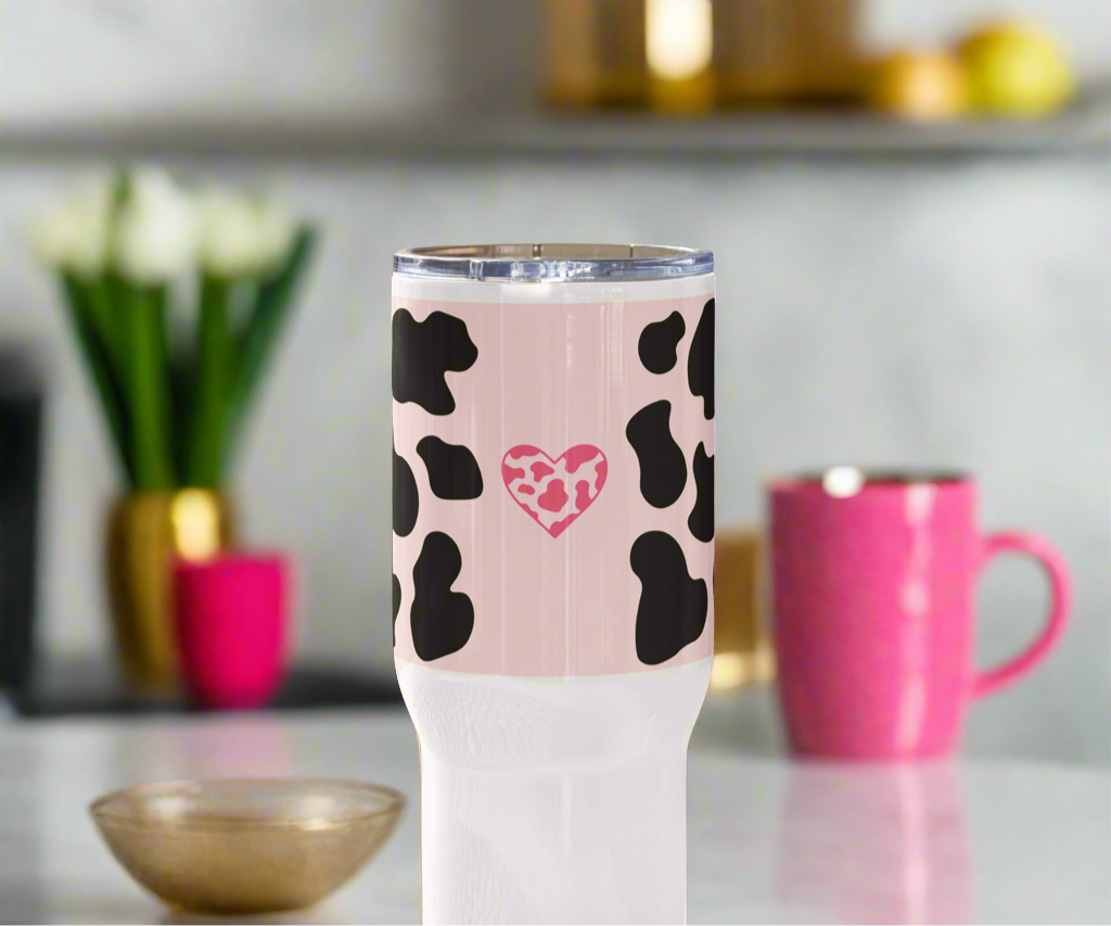 Light pink animal travel mug with a handle.