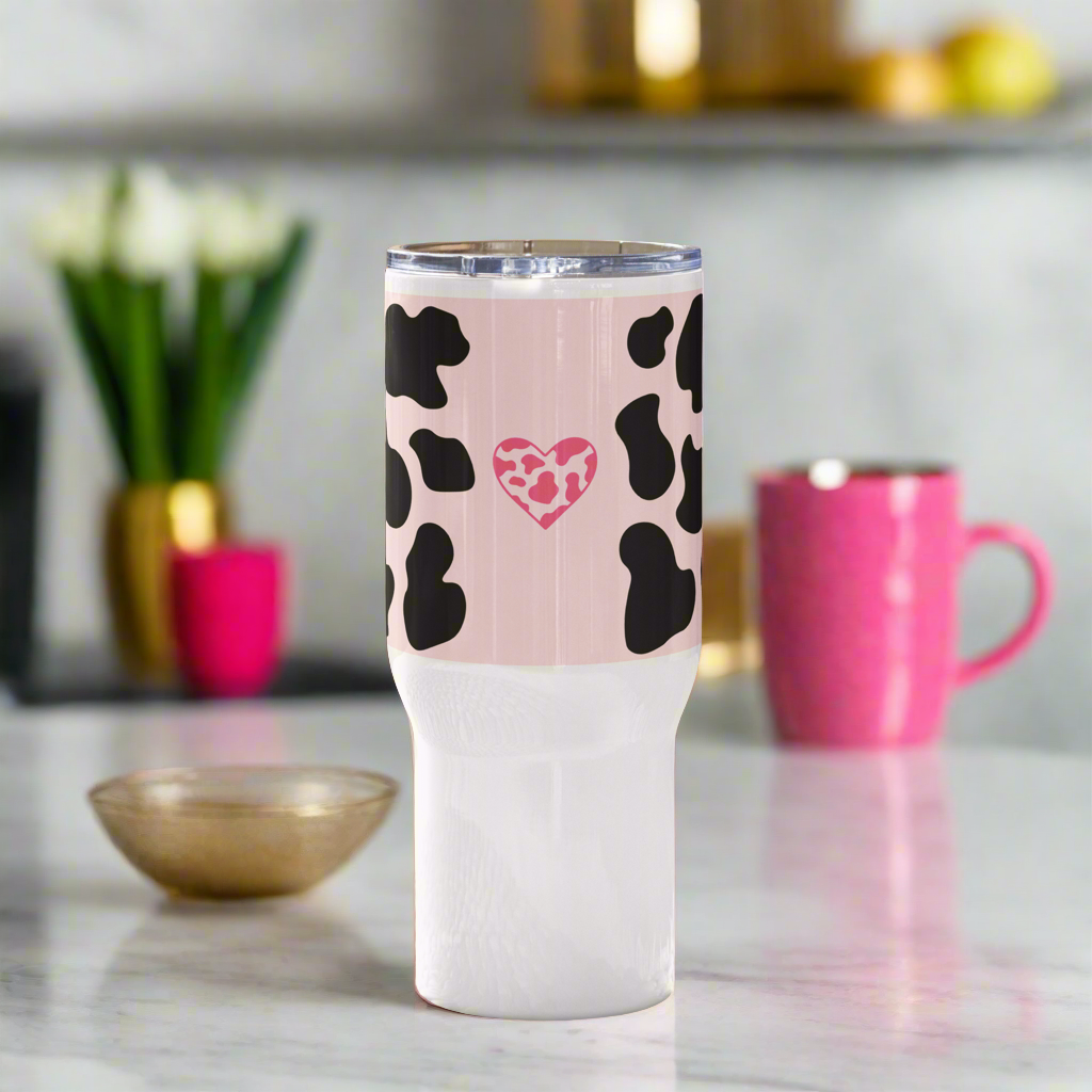 Light pink animal travel mug with a handle.