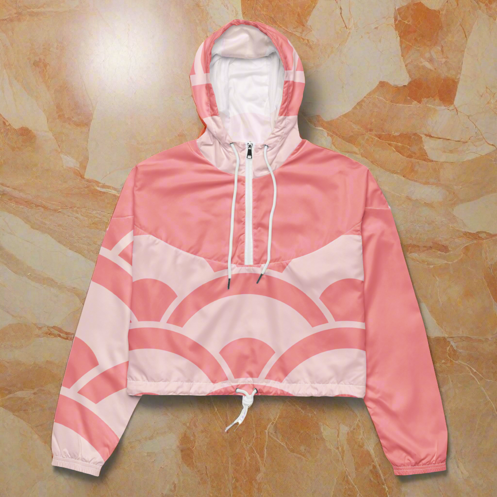 Orange and light pink women’s cropped asymmetric sleeve windbreaker.