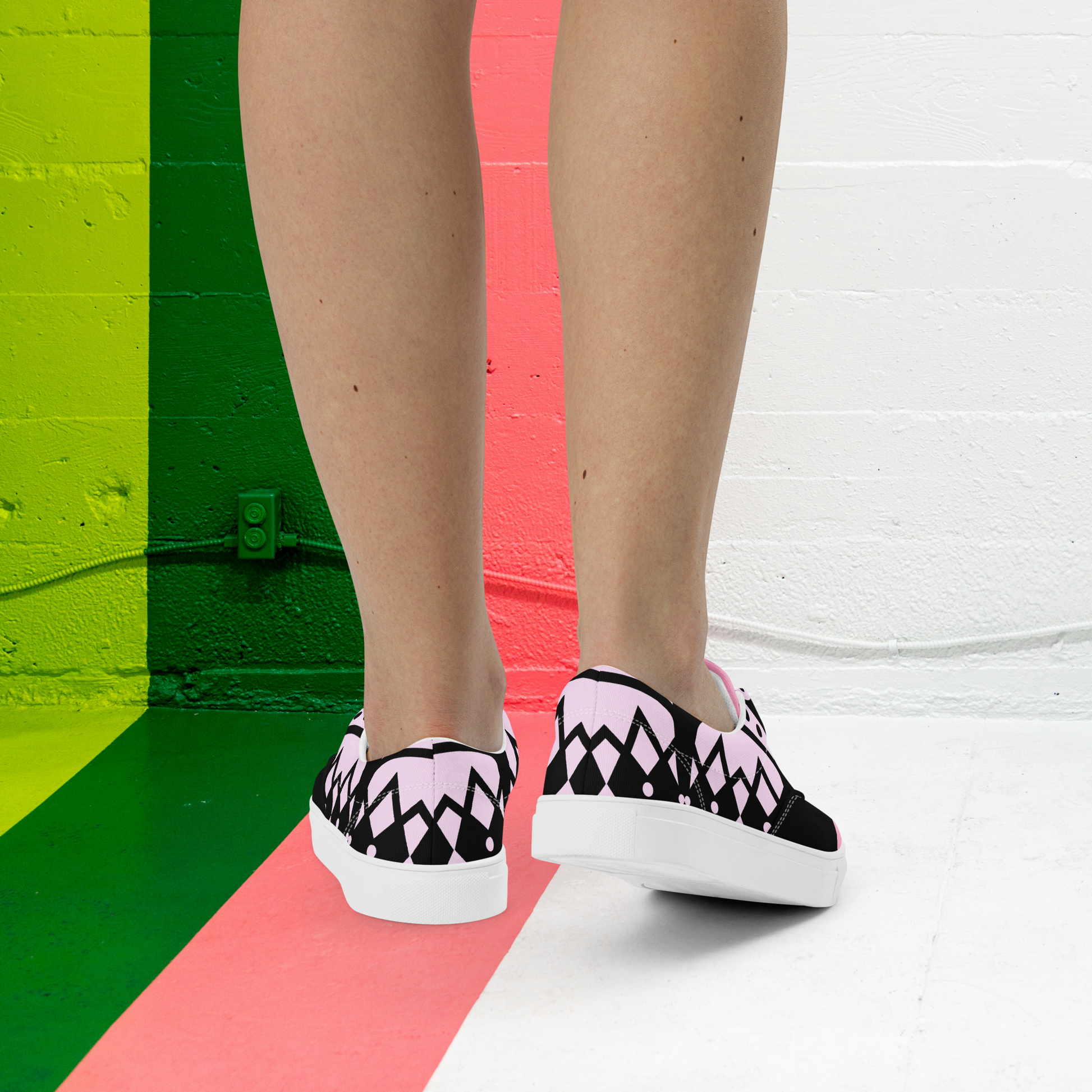 Black and lilac women’s laced canvas shoes.