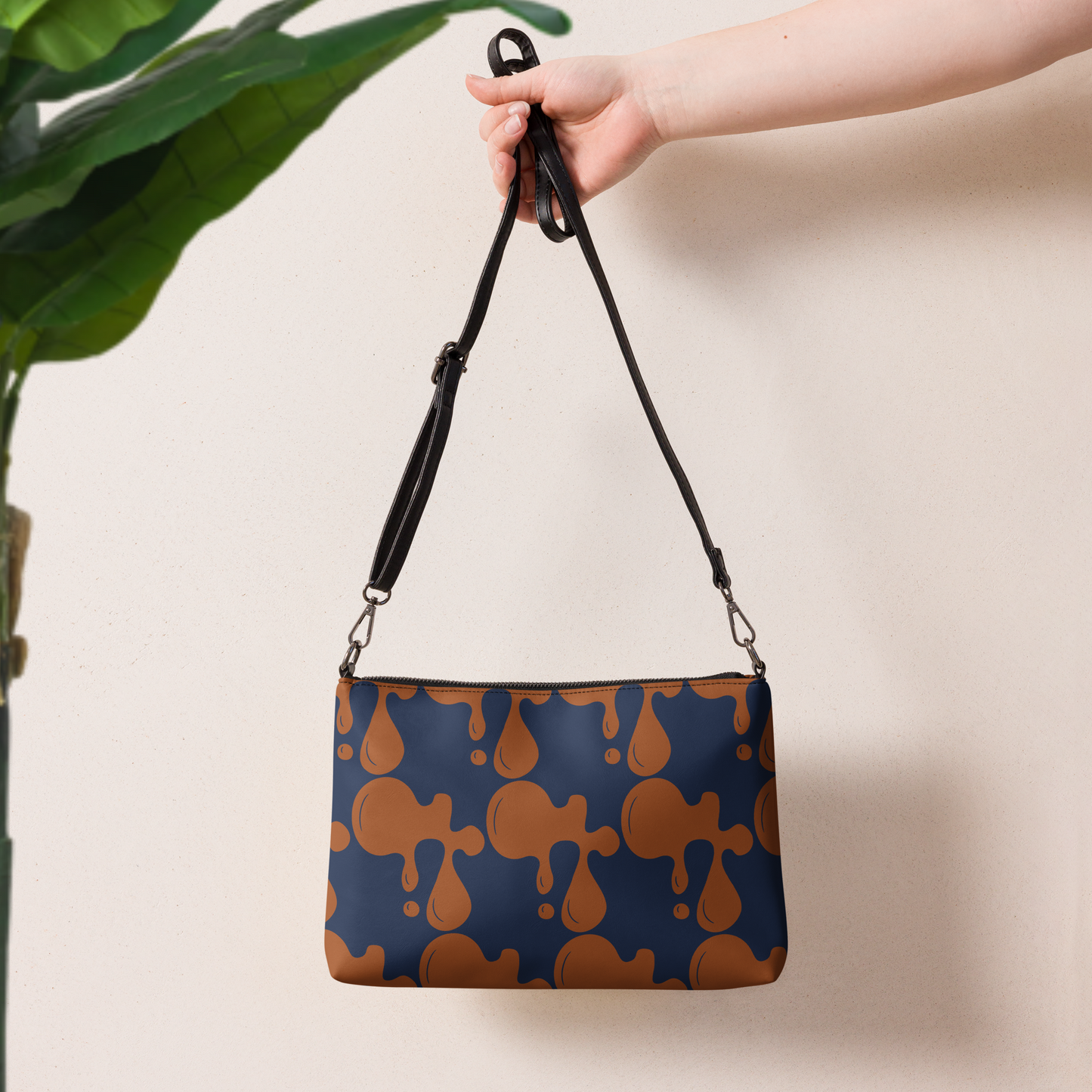 Navy blue and brown crossbody handbag.