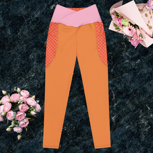 Orange and multi-color women’s crossover leggings with pockets.