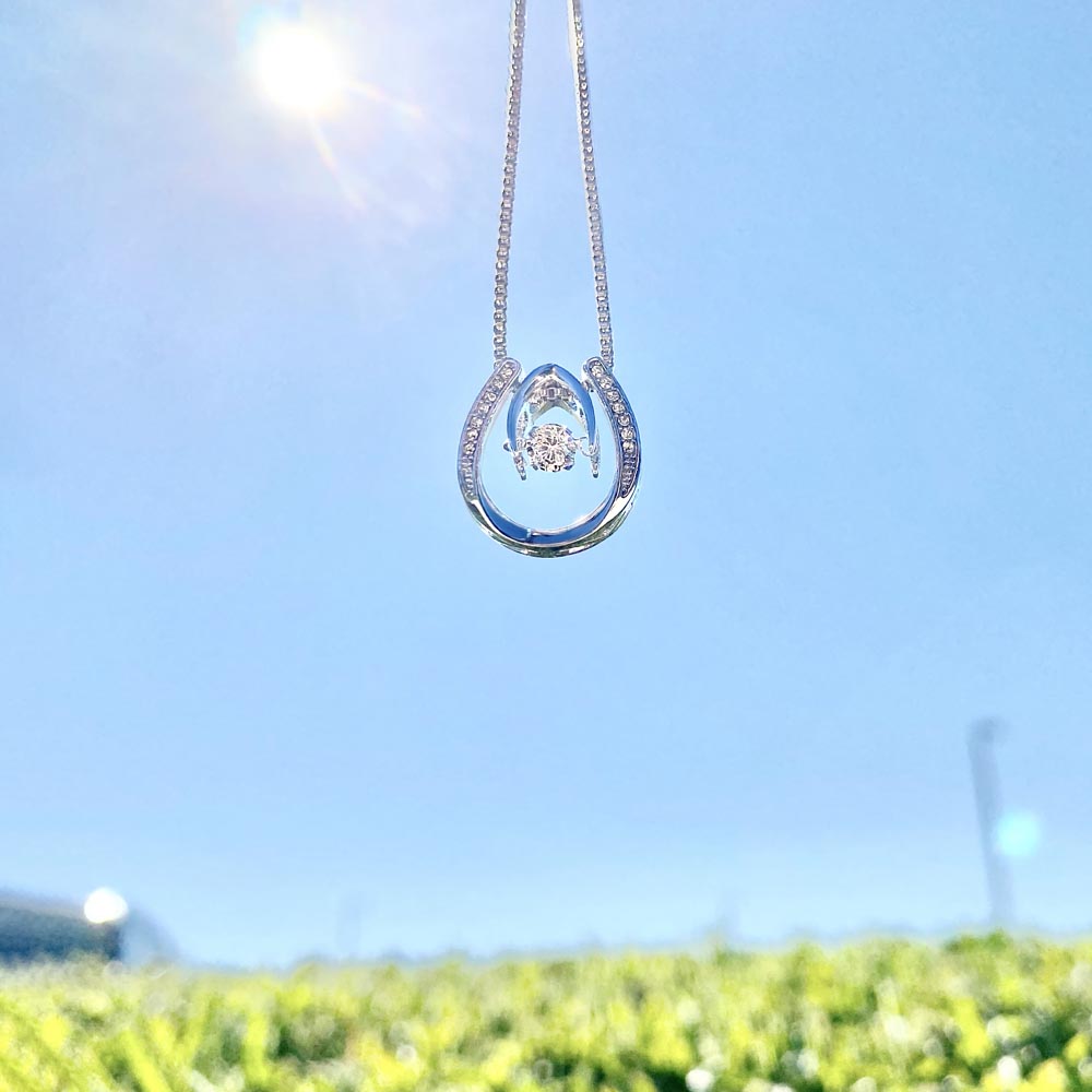 Unique white gold dipped cz necklace.