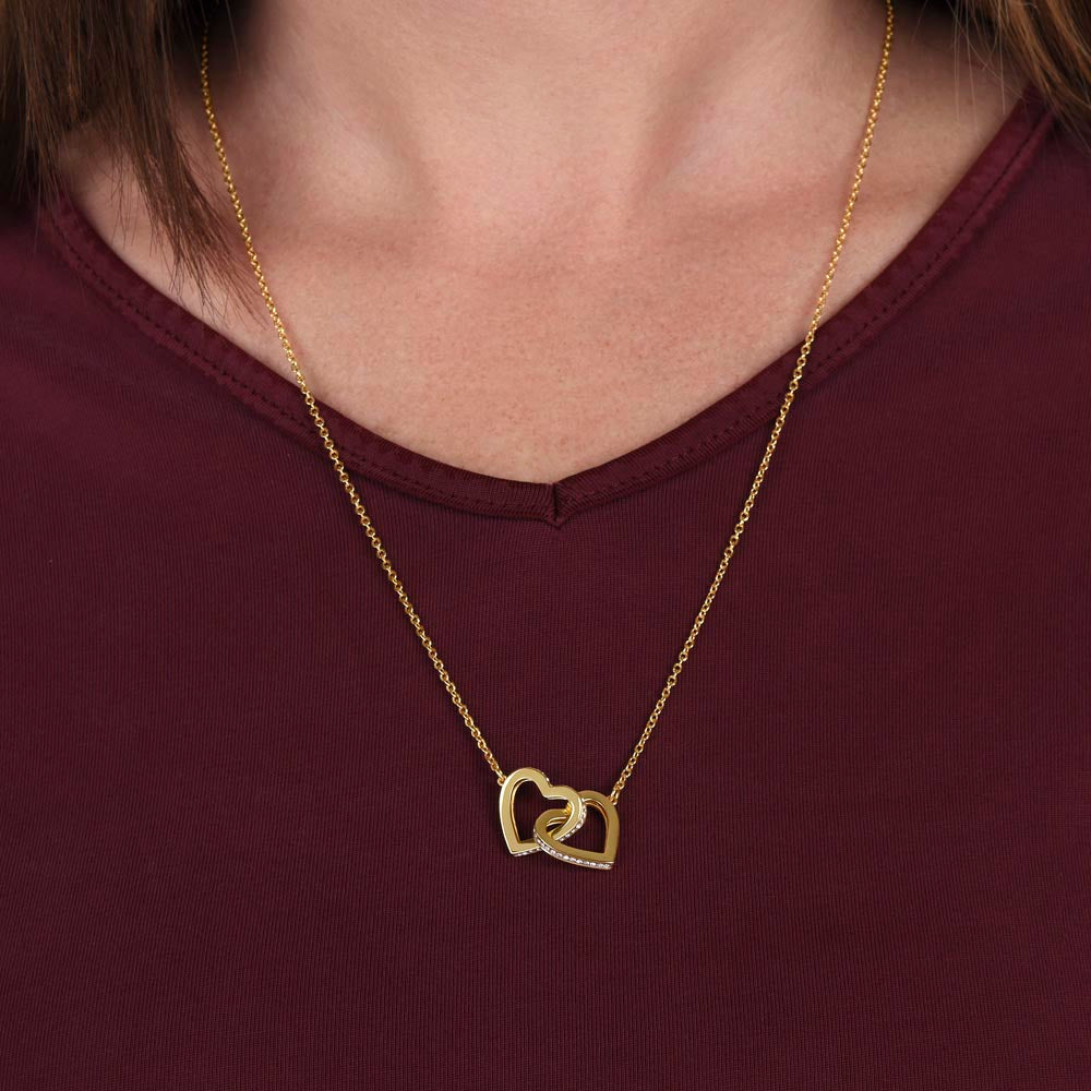 Heart of two intertwined white or yellow gold cz necklace.