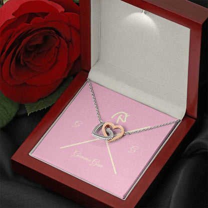 Heart of two intertwined white or yellow gold cz necklace.