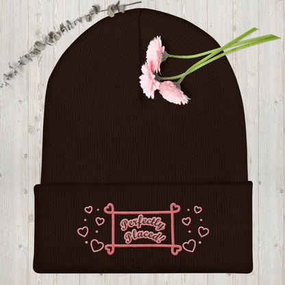 Cuffed brown or dark gray multi-color perfectly placed women’s beanie.