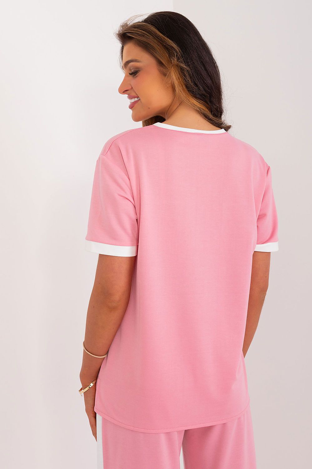 Pink buttoned women’s blouse.