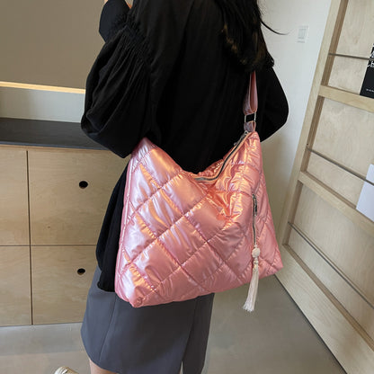 Quilted medium nylon travel handbag.