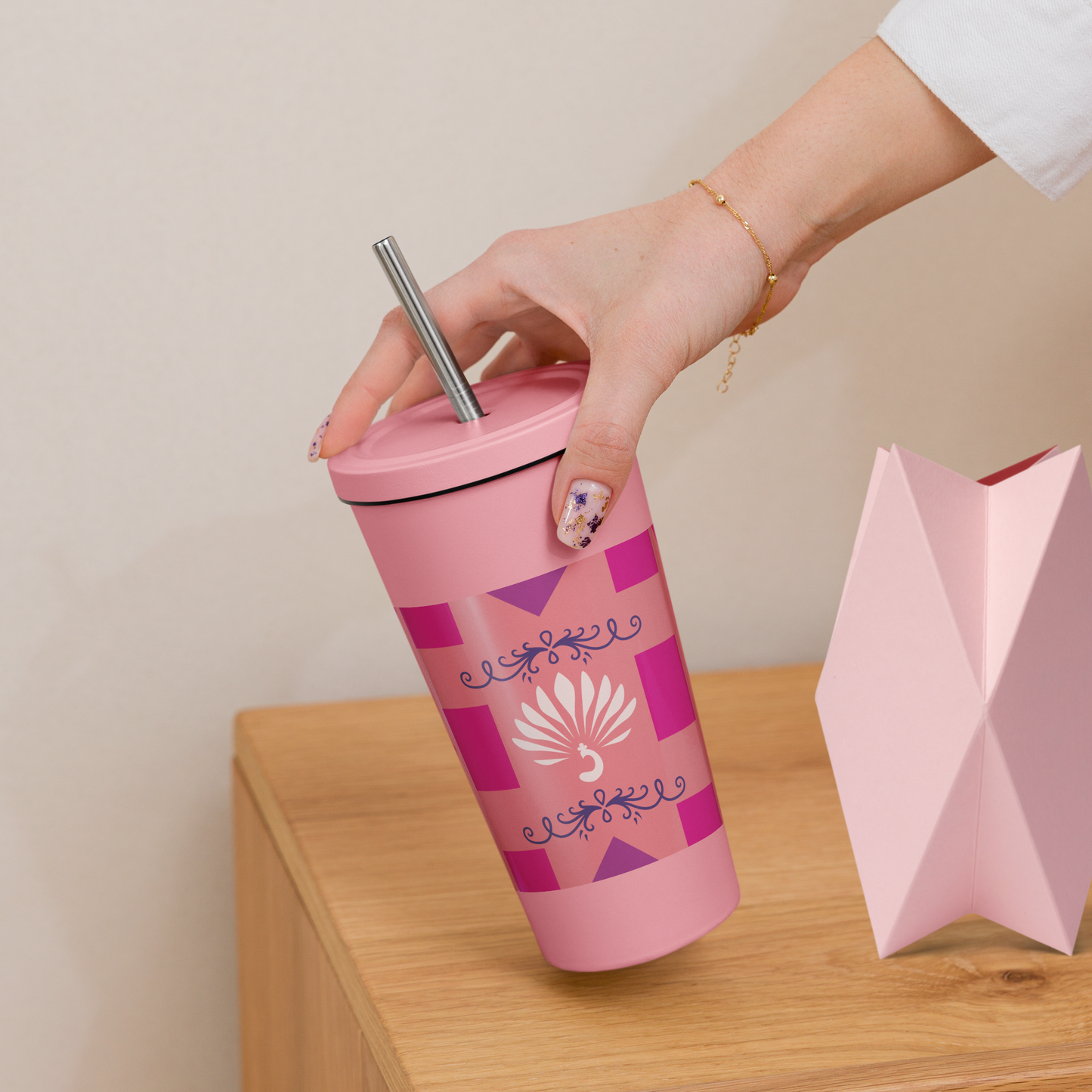 Hot pink peacock insulated stainless steel tumbler with a straw.