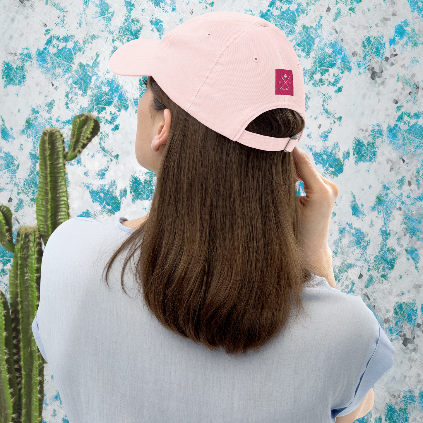 Gorra de béisbol rosa pastel con arpa.