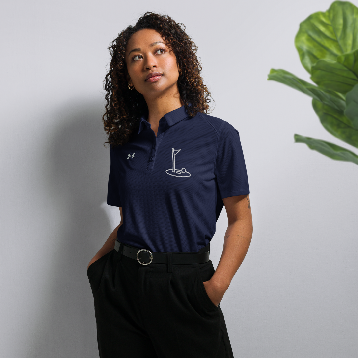 Navy blue under armour® women’s polo shirt.