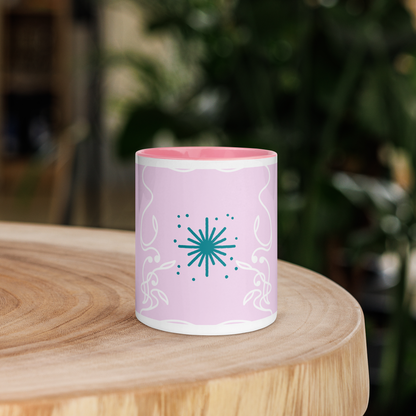 Soft pink and teal mug with color inside.