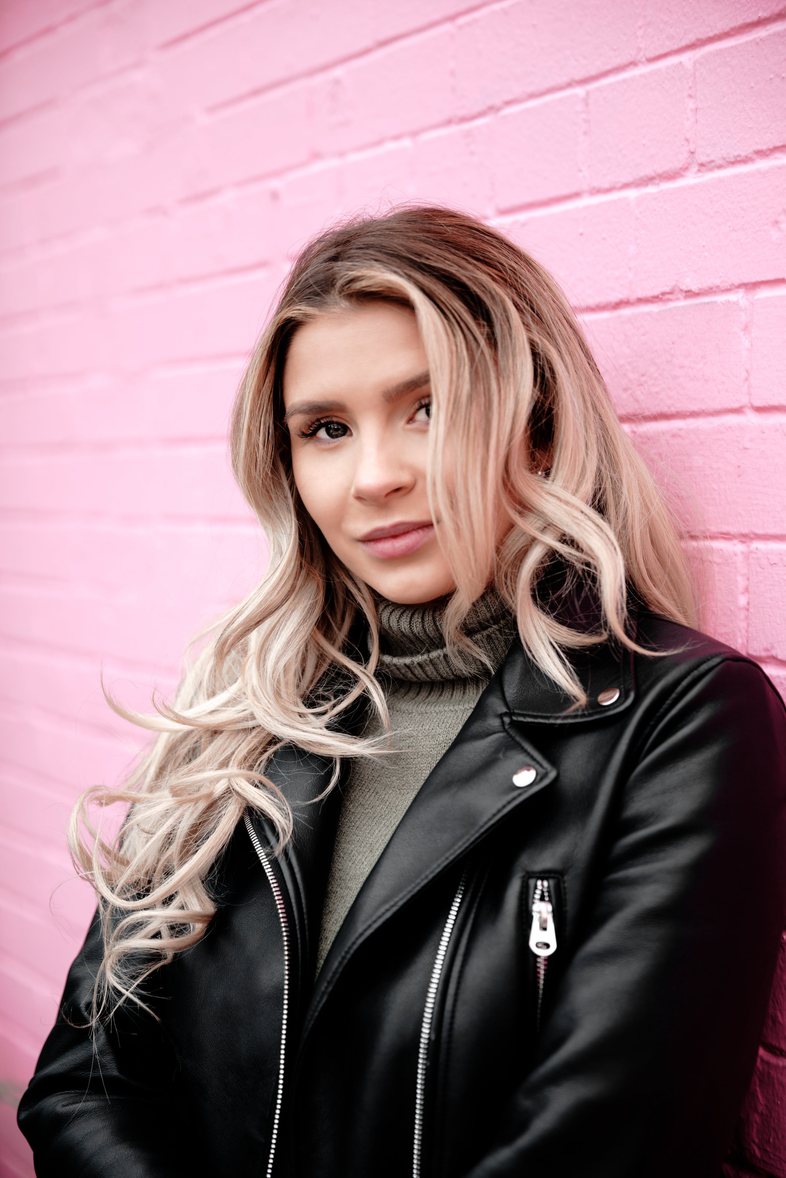 woman-portrait-on-pink-brick