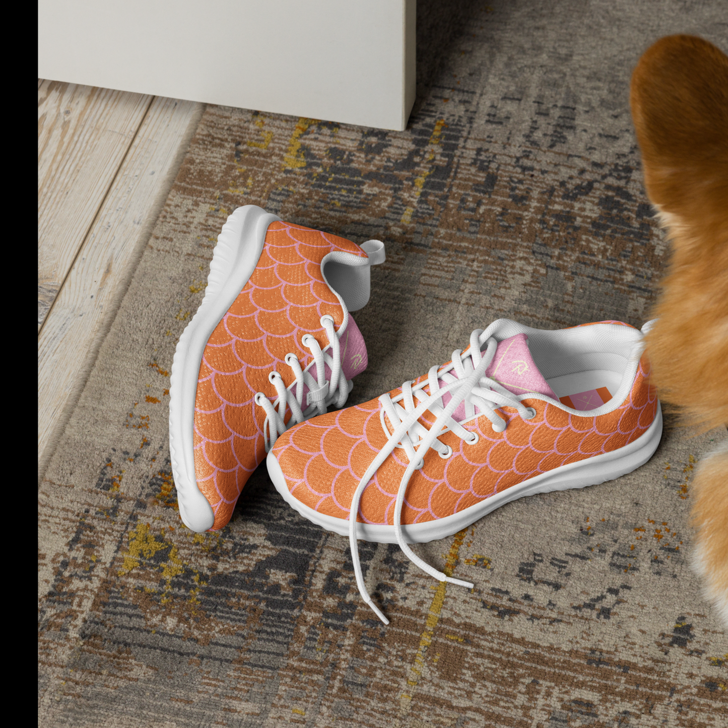 Orange and light pink women’s athletic shoes.