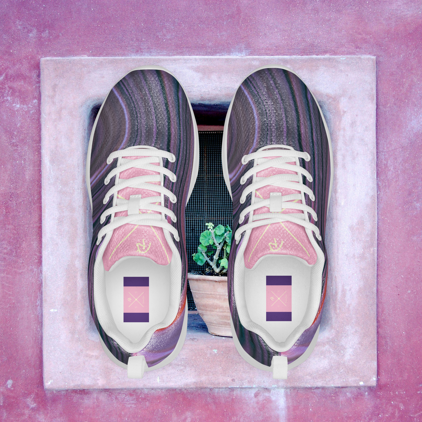 Purple and pink women’s athletic shoes.