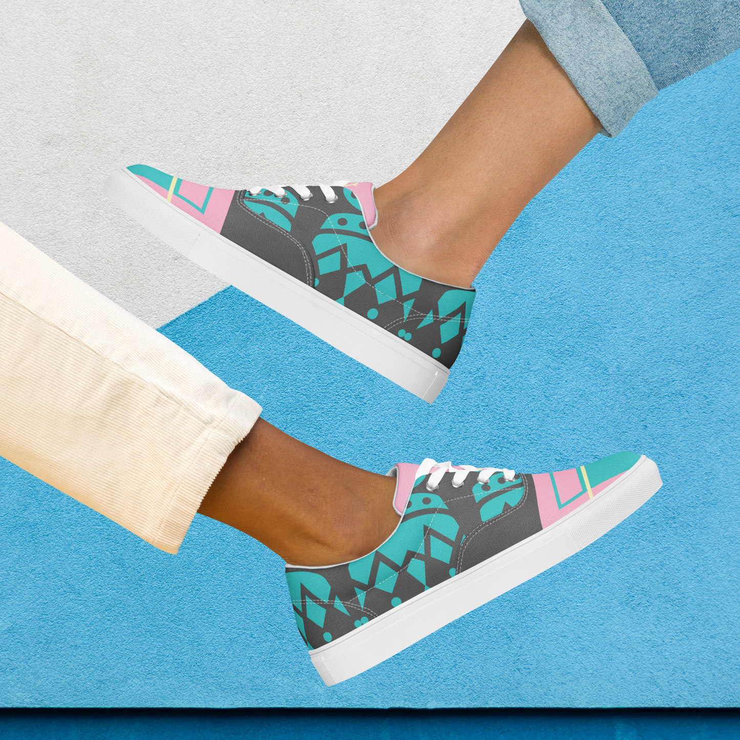 Gray and turquoise women’s laced canvas shoes.