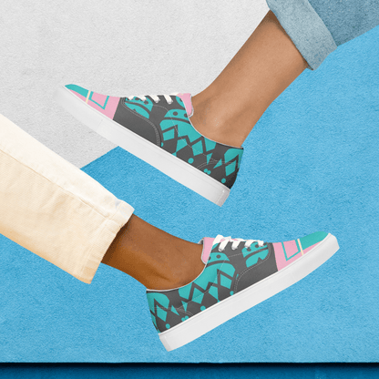 Gray and turquoise women’s laced canvas shoes.